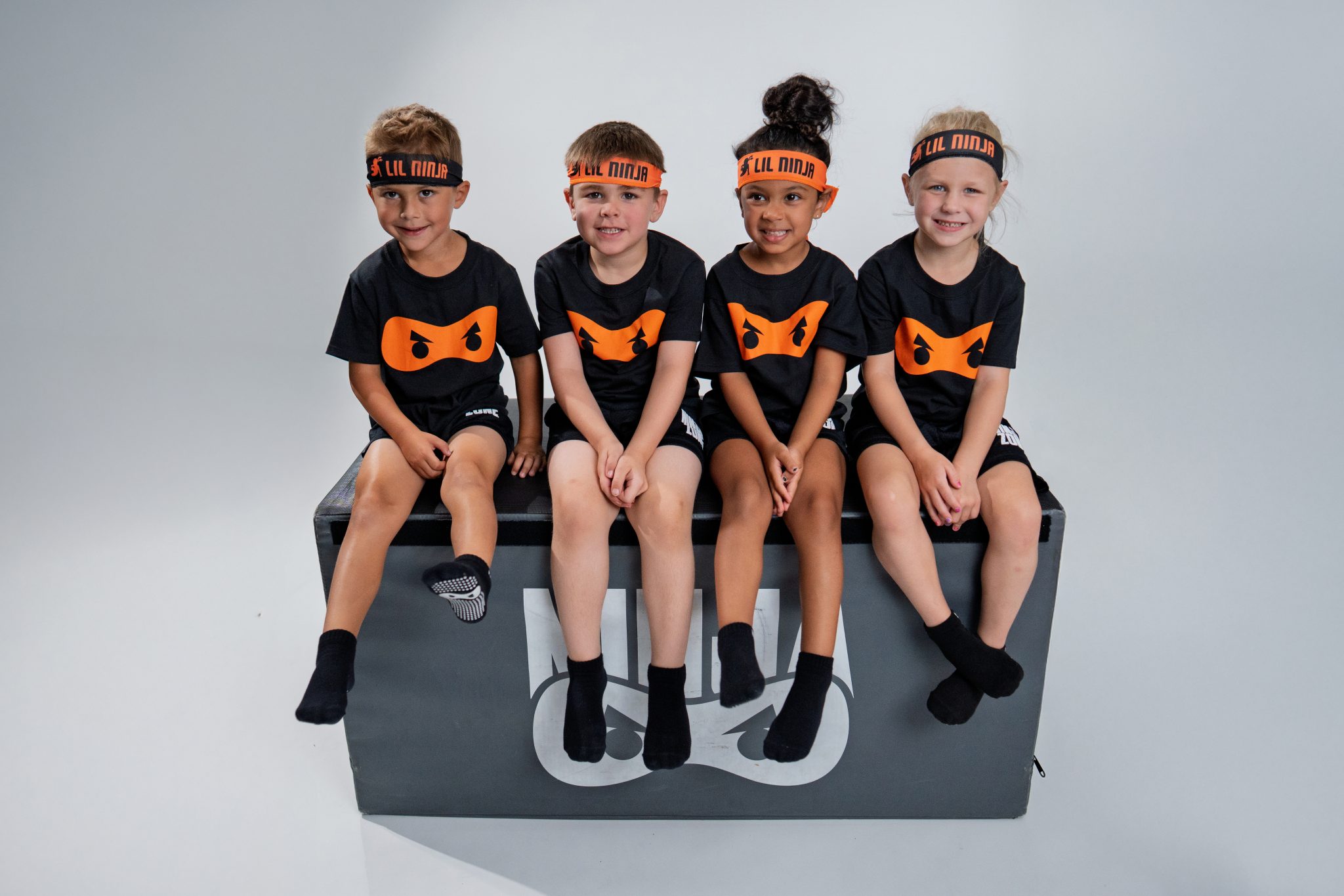 Lil Ninjas sitting on a spotting block