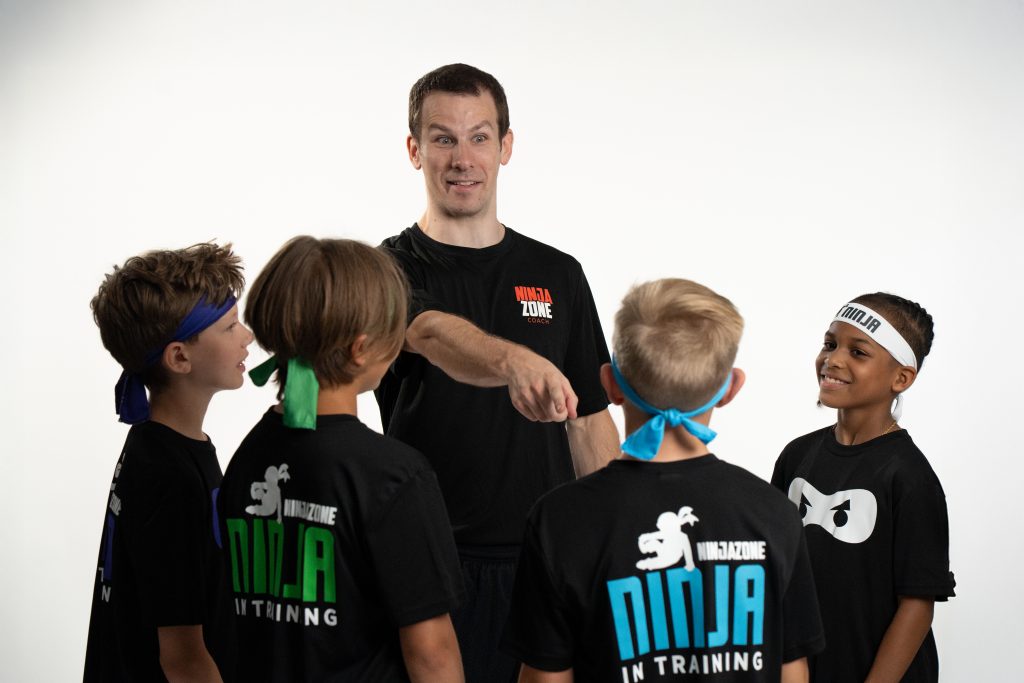 Coaches instruction during class
